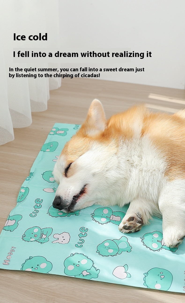Sleeping dog resting on a blue dog cooling gel pad with cartoon animal prints indoors