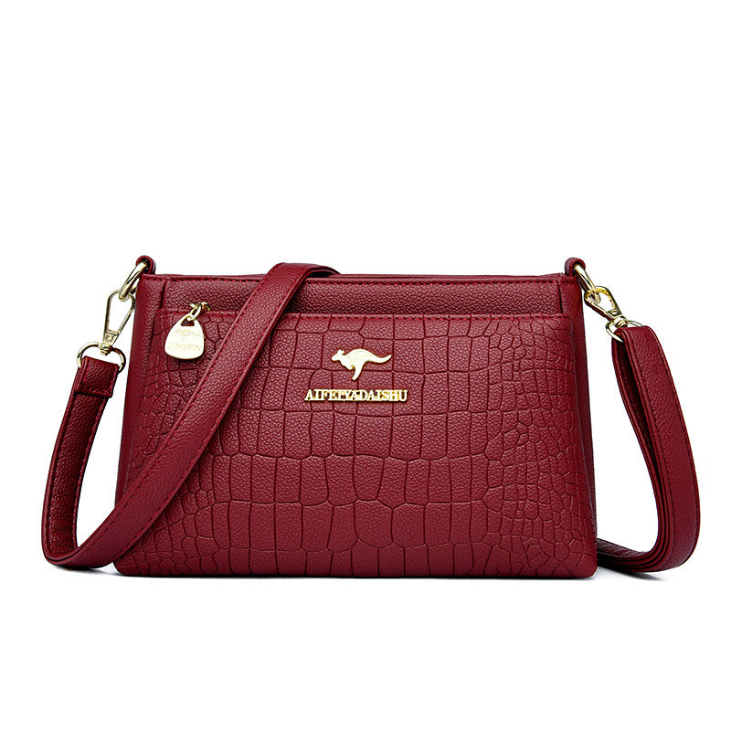 Sheila Merchandise red textured leather purse for every occasion with adjustable strap