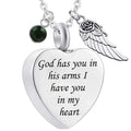 Heart-shaped Wing Urn cremation jewelry pendant with engraved message and decorative charms by Sheila Merchandise
