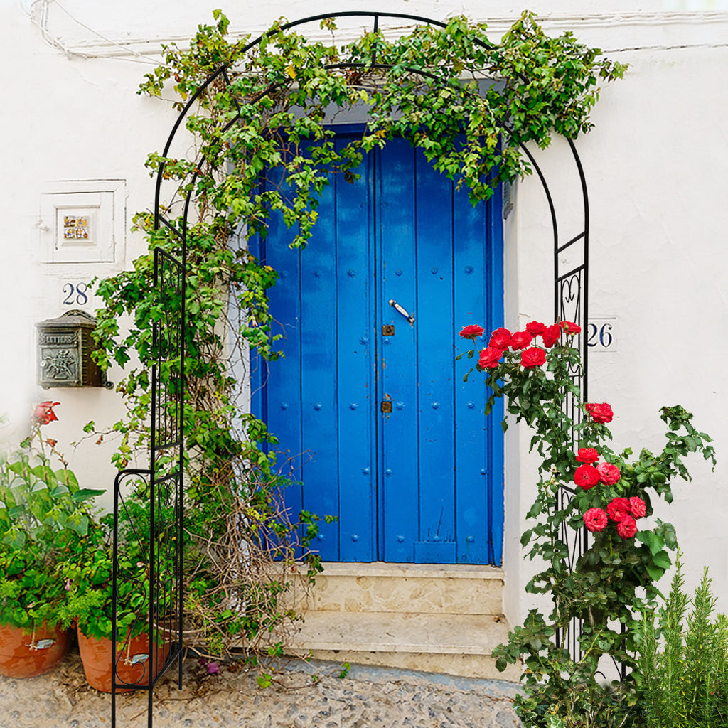 Decorative garden arch for climbing plants adorned with green vines and vibrant roses