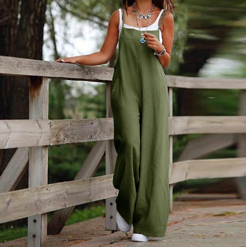 Green loose-fitting fashion jumpsuit for women with white tank top and layered necklaces