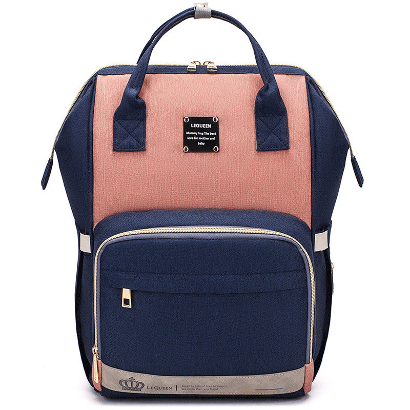 Sheila Merchandise parent-approved diaper backpack in navy and pink with multiple compartments
