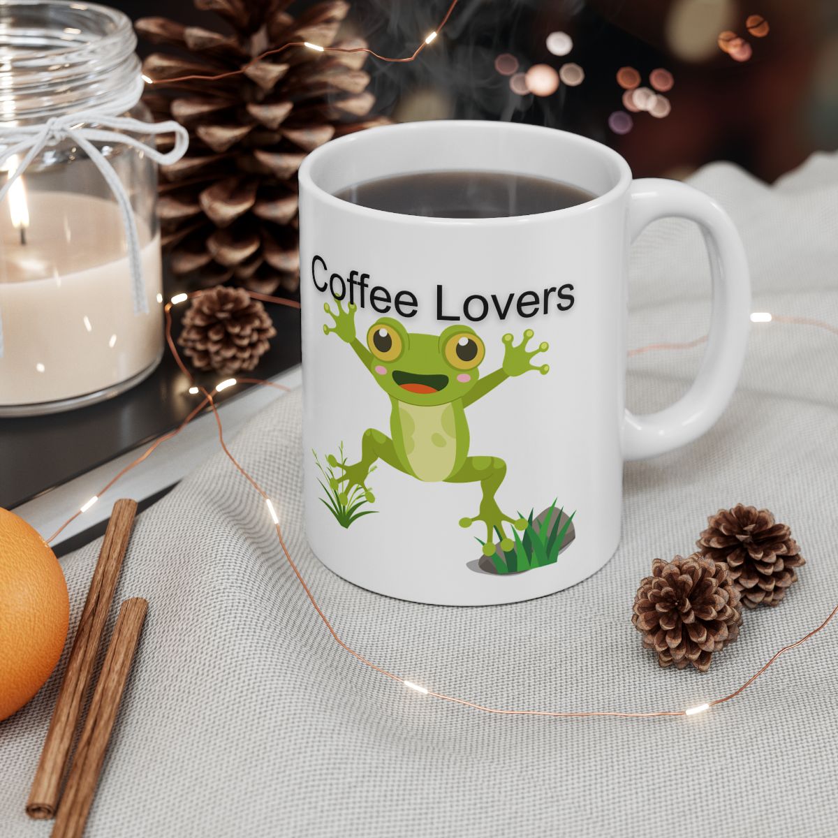 White novelty coffee mug for frog lovers featuring a cheerful frog design with the text Coffee Lovers