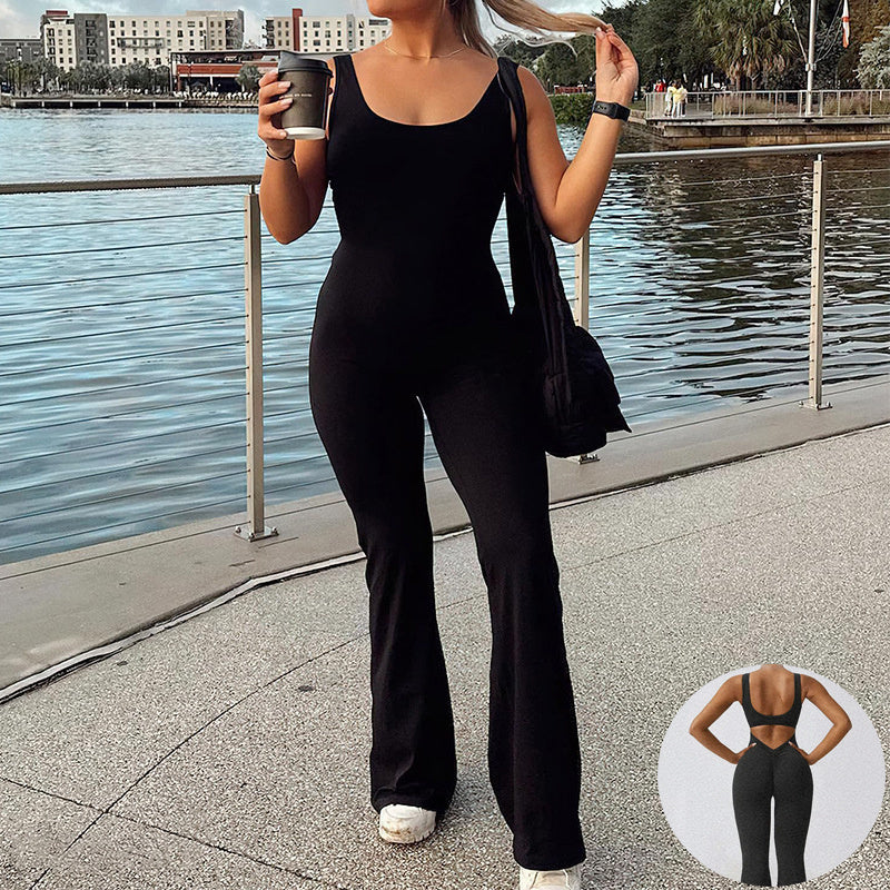 Black slim fit jumpsuit for women with scoop neckline and open back worn by a woman outdoors
