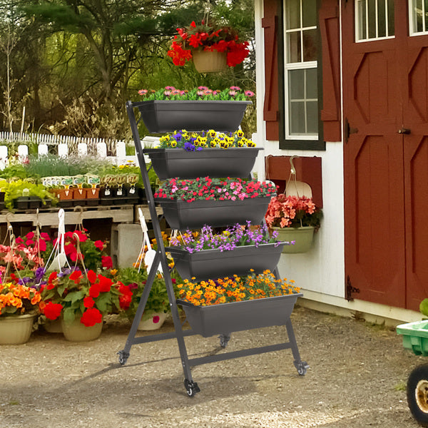 Sheila Merchandise stackable garden beds in a decorative display with vibrant flowers for a beautiful garden setting