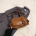 Brown women's shoulder underarm Boston bag by Sheila Merchandise stylish underarm purse on gray coat