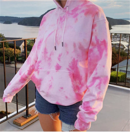 Sheila Merchandise casual tie-dye pullover hoodie in pink and white worn with denim shorts outdoors