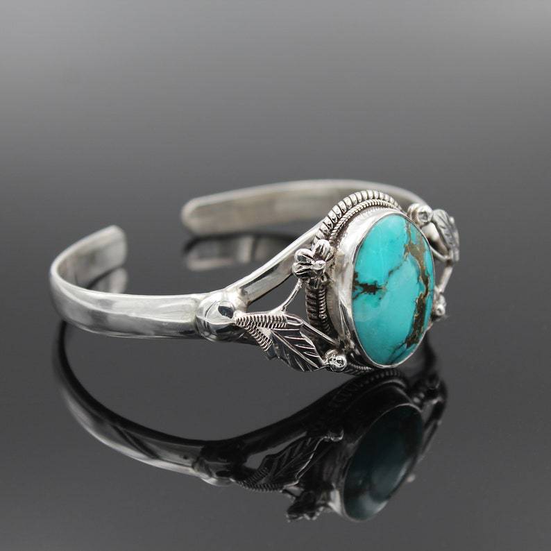 Women's vintage turquoise bracelet for women with engraved silver detailing and oval stone
